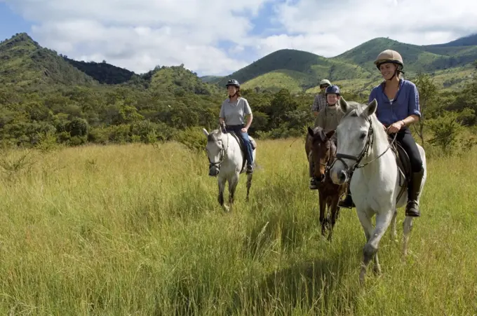 Kenya, Chyulu Hills, Ol Donyo Wuas.  Family on a riding safari with Ride Africa in the Chyulu Hills. (MR)