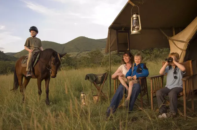 Kenya, Chyulu Hills, Ol Donyo Wuas. Family on a riding safari with Ride Africa in the Chyulu Hills. (MR)