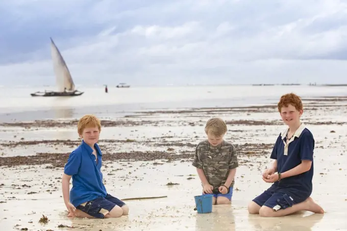 Kenya, Coast, Diani Beach.  Children play on the beach. (MR)