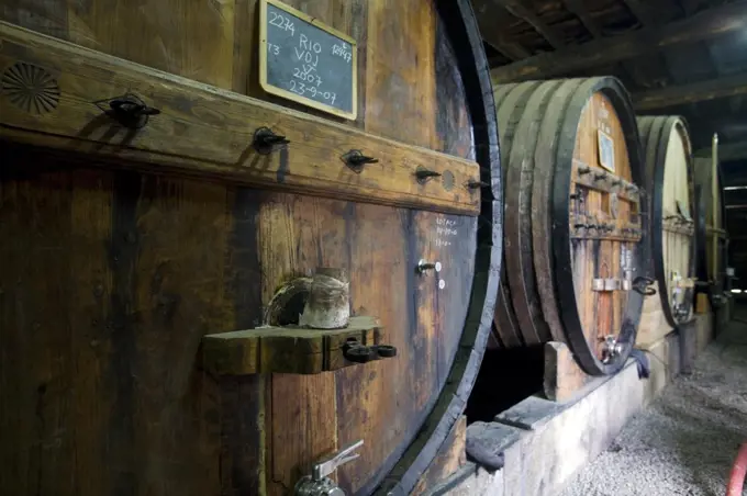 Portugal, Douro Valley, Pinhao. Traditional Port Wine Barrels in Northern Portugal in the renowned Douro valley. The valley was the first demarcated and controlled winemaking region in the world.