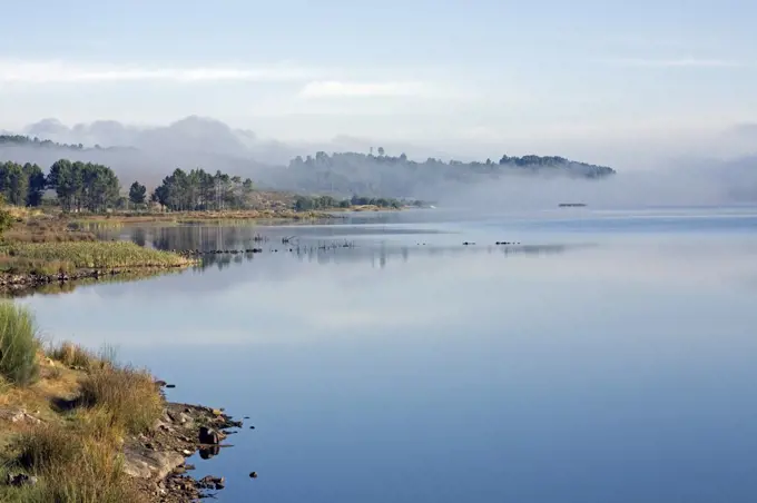 Portugal, Beira Alta, Penedono. A tranquil dawn overlooking a lake near Penedono in the Beira Alta region in Northern Portugal.