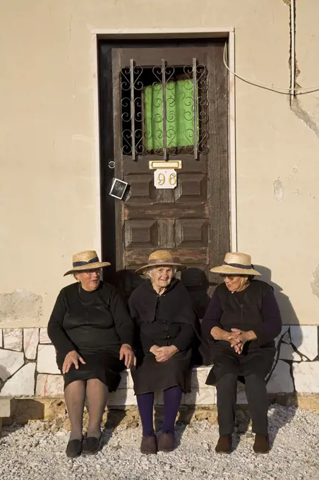 Portugal, Alentejo, Estremoz. Three elderly Portuguese ladies (Ana Carvallal, Marianna Bailao and Catarina Amaro) near the town of Estremoz in the Alentejo region of Portugal. It is customary for widows to always wear black.