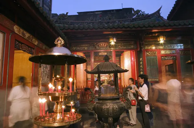 Longshan Temple worshippers and incense burners