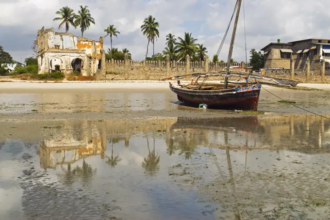 East Africa, Tanzania, Zanzibar. A boat moored on the sands of Bagamoyo.