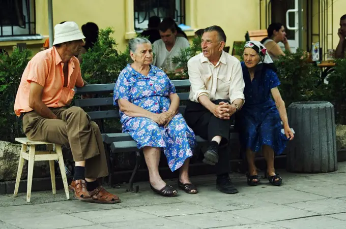 Old Locals Talking on Bench