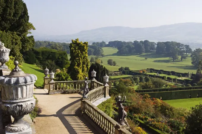 Wales; Powys; Welshpool. View over the Aviary Terrace with its Italianate sculptures of shepherds and shepherdesses and ornate ballustrading at the spectacular garden at Powis Castle