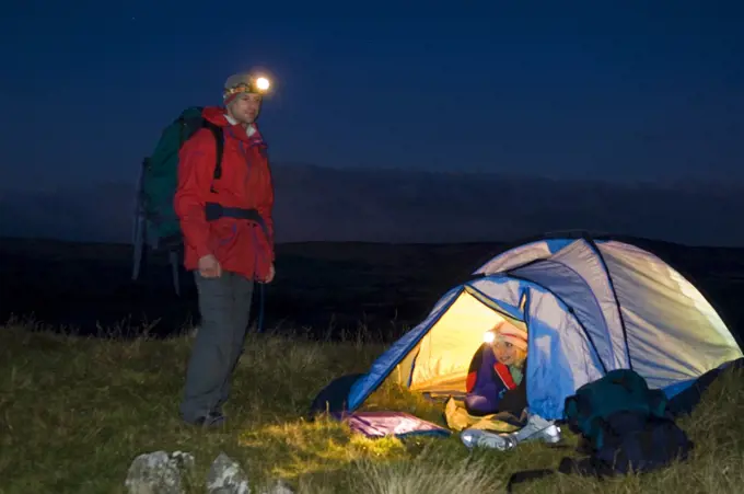 Gilar Farm, Snowdonia, North Wales.  Man and woman camping . (MR)