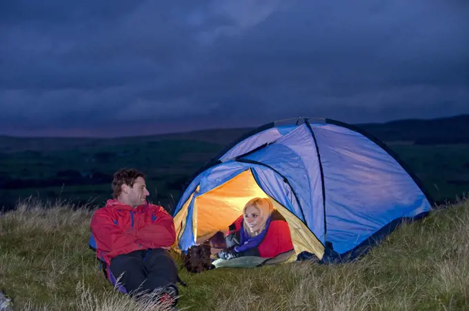 Gilar Farm, Snowdonia, North Wales.  Man and woman camping in the wild. (MR)