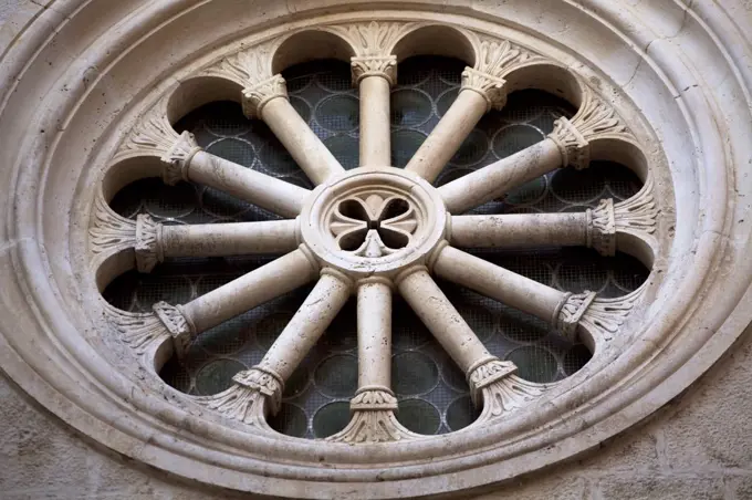 Croatia, Trogir, Central Europe. Detail of a window on a church. UNESCO