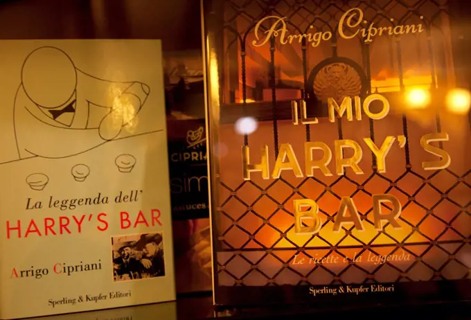 Venice, Veneto, Italy, Books on display at Harrys Bar