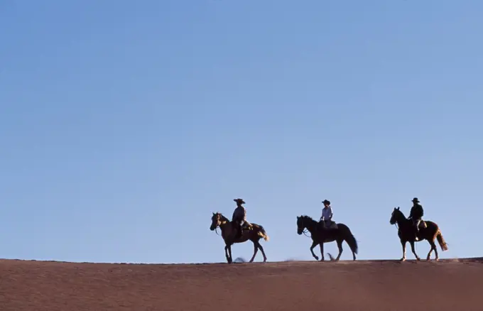 Chile, Atacama Desert. Horse riding in the Atacama desert.