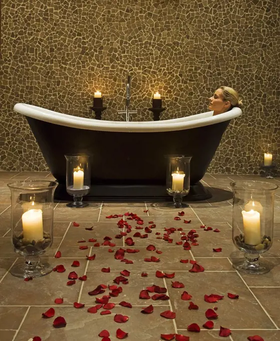 Northern Ireland, Fermanagh, Enniskillen. A woman enjoys a hot soak in the luxurious slipper bath in the twin treatment room of the Thai spa at Lough Erne Golf Resort (MR).