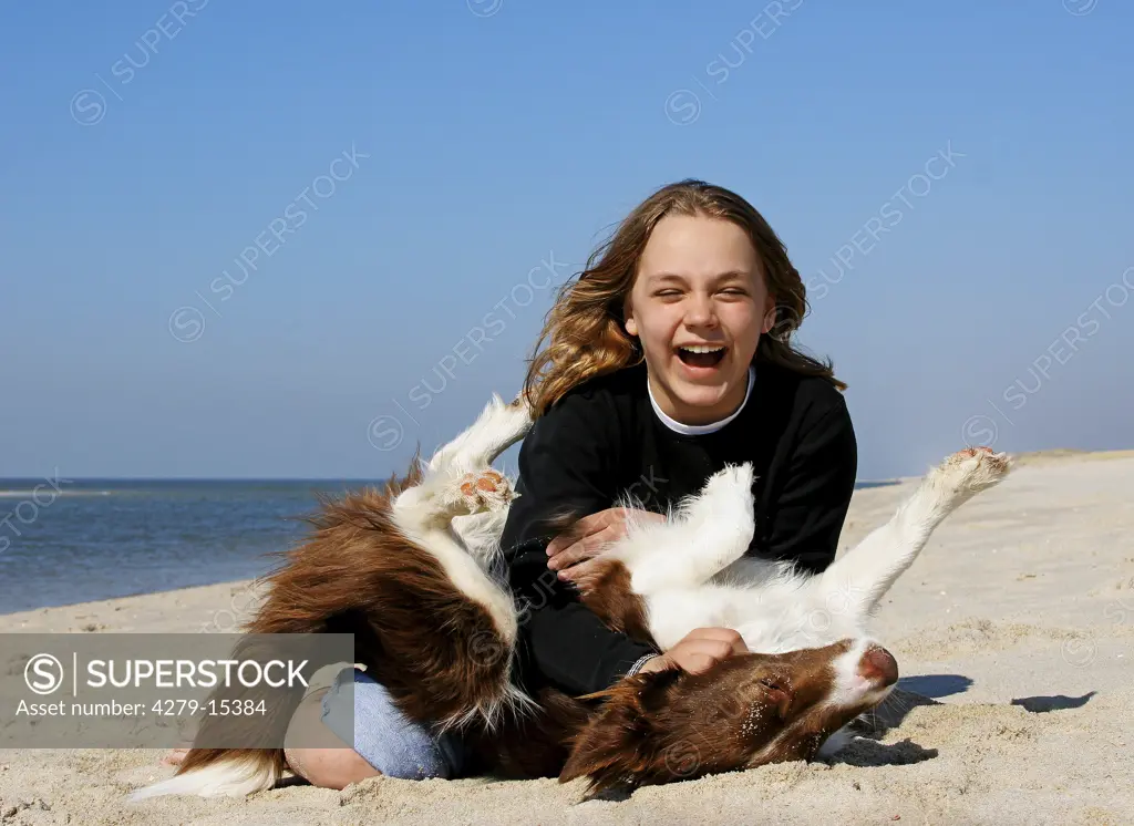 girl and Border Collie - playing