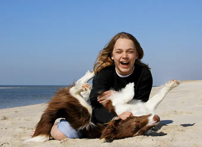 girl and Border Collie - playing