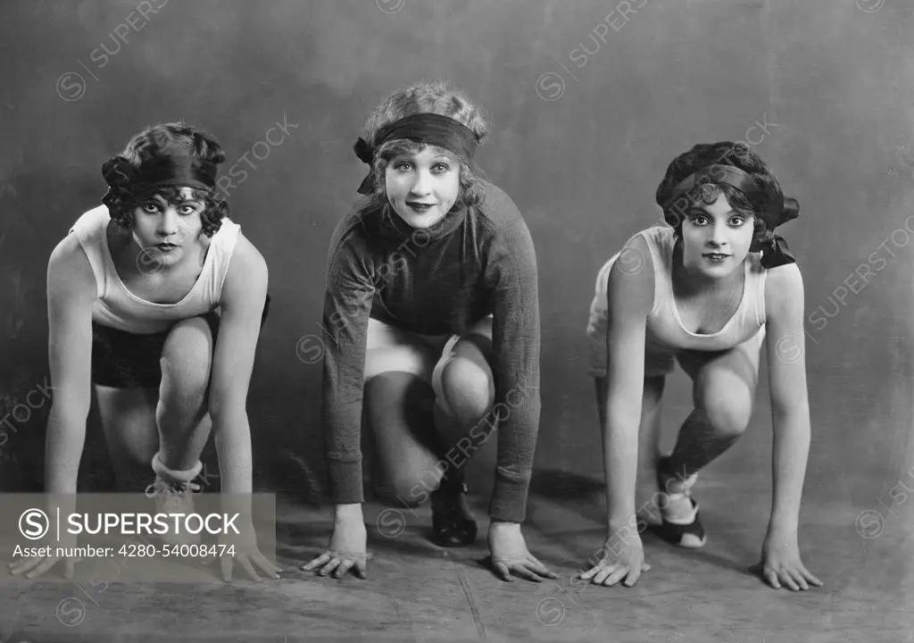 Portrait of three female runners in starting position (EV003262_H)