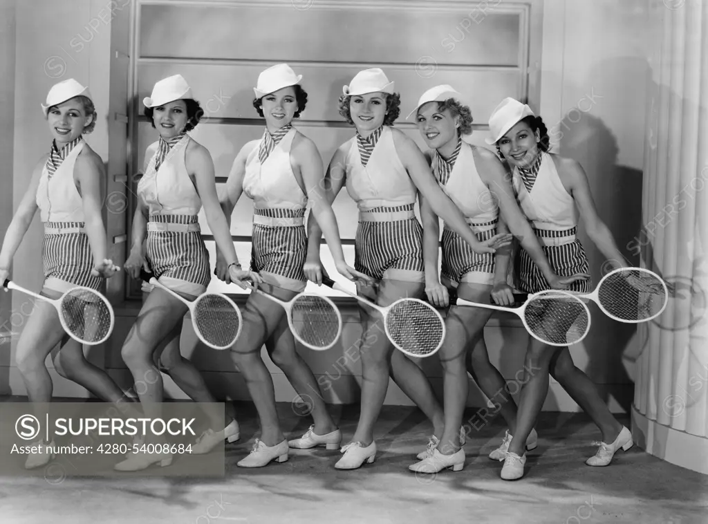 Row of female tennis players in matching outfits (EV003463_H)