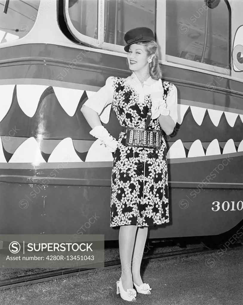 Female conductor standing in front of a tour trolley All persons depicted are not longer living and no estate exists Supplier warranties that there wi...