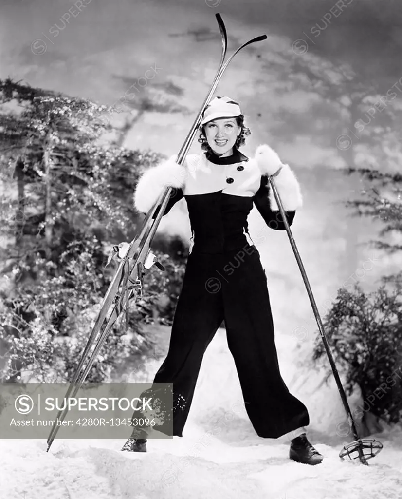 Portrait of a young woman skiing and smiling All persons depicted are not longer living and no estate exists Supplier warranties that there will be no...