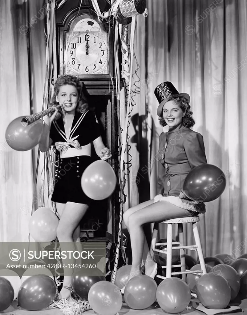 Women with balloons on New Years Eve All persons depicted are not longer living and no estate exists Supplier warranties that there will be no model r...