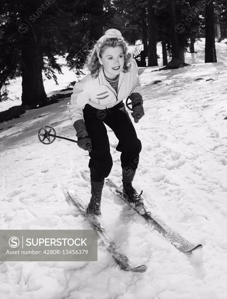 Woman on skiis with knees bent