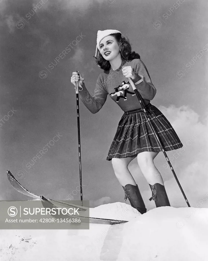 Low angle view of young woman skiing