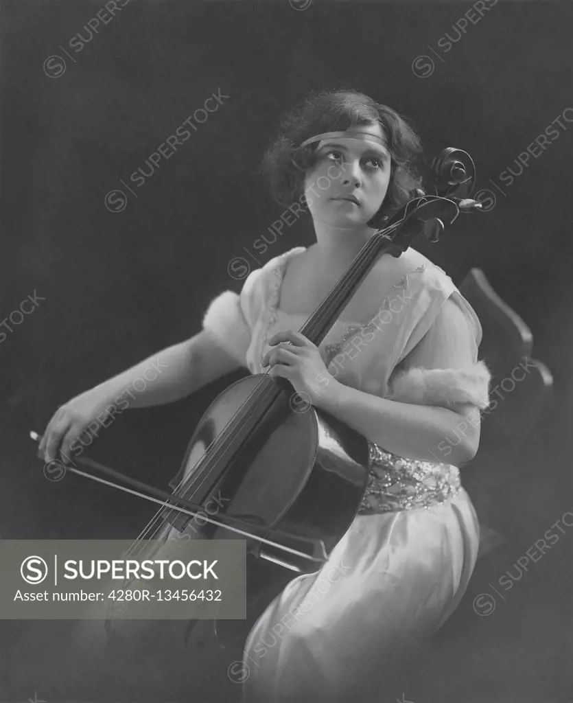 Contemplating woman plays violin