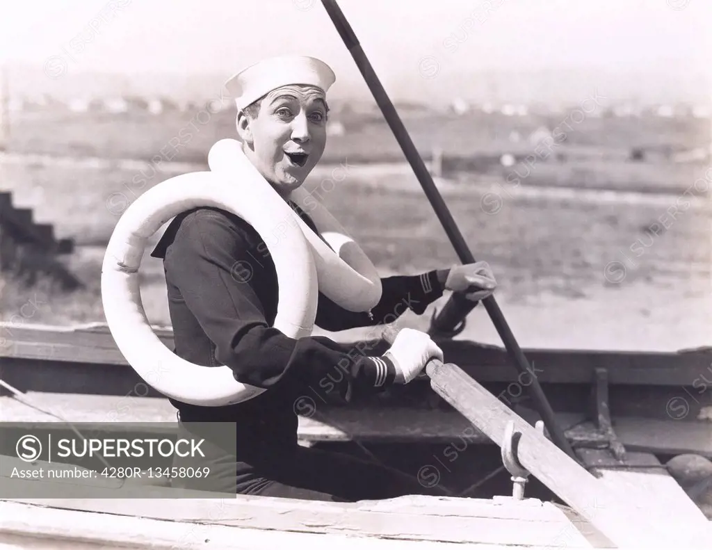 Sailor wearing two life preservers (OLVI008_OU065_F)