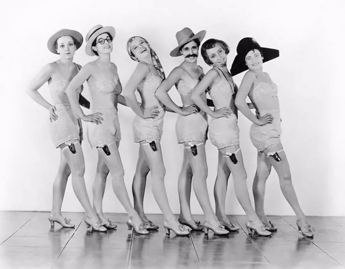 Women standing in a chorus line in lingerie All persons depicted are not longer living and no estate exists Supplier warranties that there will be no ...