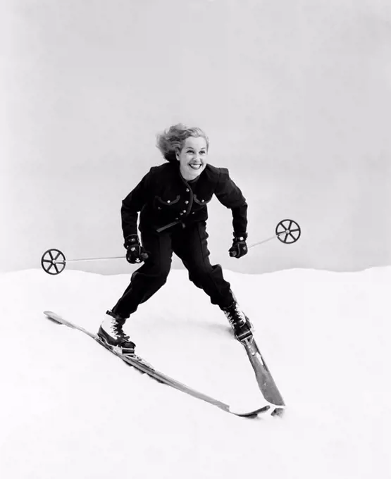 Female skier skiing downhill All persons depicted are not longer living and no estate exists Supplier warranties that there will be no model release i...