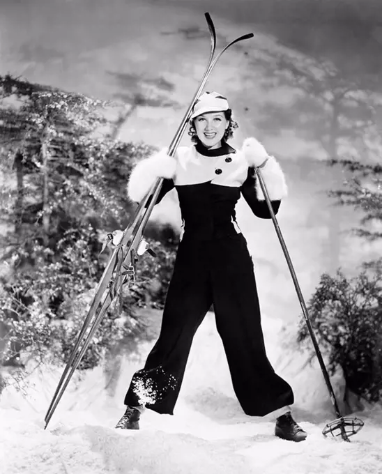 Portrait of a young woman skiing and smiling All persons depicted are not longer living and no estate exists Supplier warranties that there will be no...