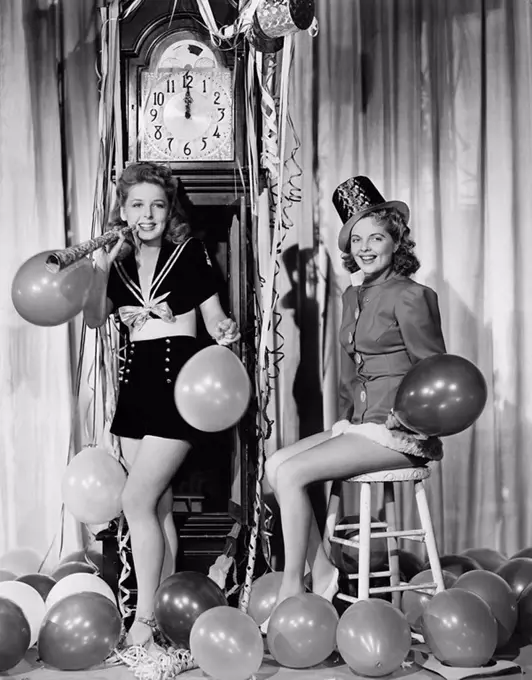 Women with balloons on New Years Eve All persons depicted are not longer living and no estate exists Supplier warranties that there will be no model r...