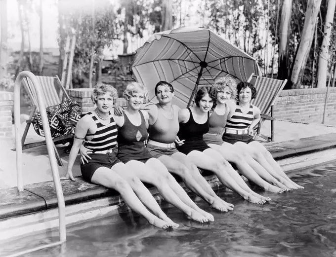 Portrait of female friends at pool All persons depicted are not longer living and no estate exists Supplier warranties that there will be no model rel...