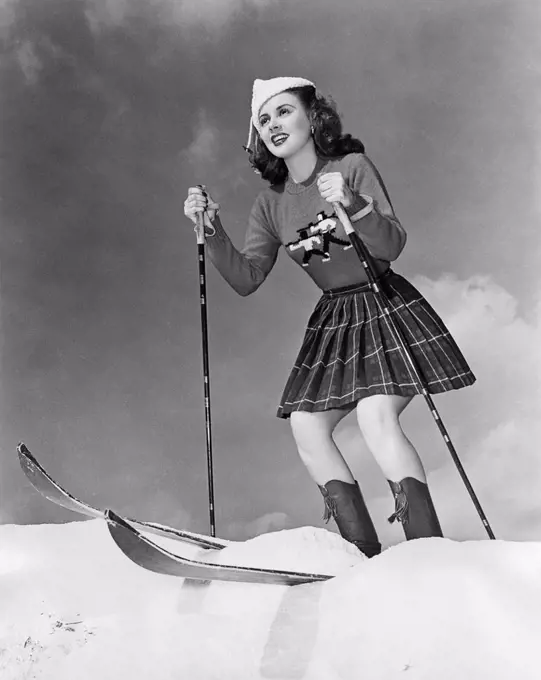 Low angle view of young woman skiing