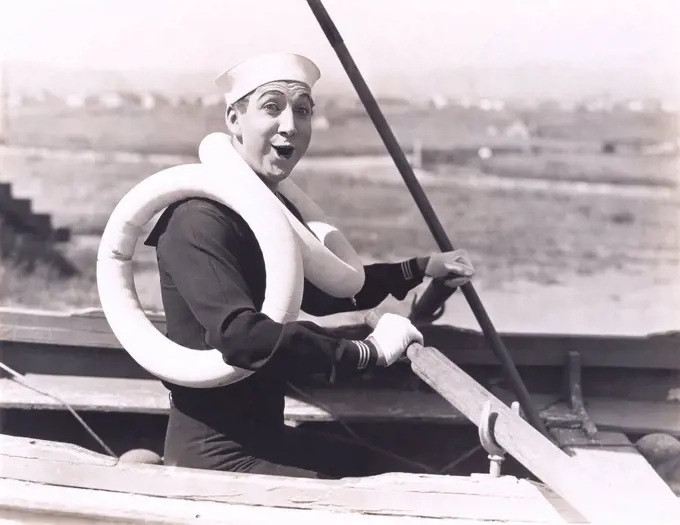 Sailor wearing two life preservers (OLVI008_OU065_F)