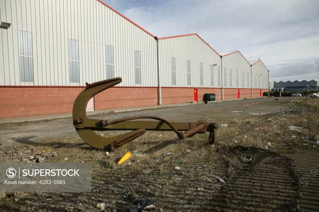 Northern Ireland, Belfast, Titanic Quarter. Warehouses and a deserted anchor in the titanic quarter of Belfast Harbour.