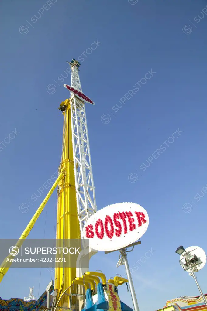 England, East Sussex, Brighton. The Booster ride in the funfair on Brighton Pier.