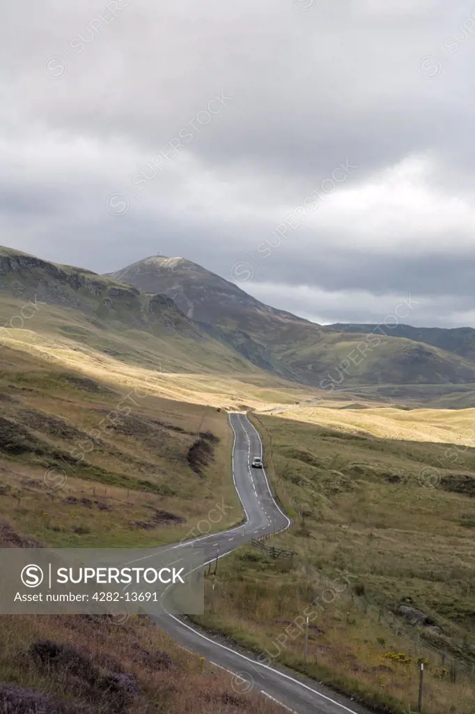 Scotland Perth and Kinross Glenshee. A car travelling along the