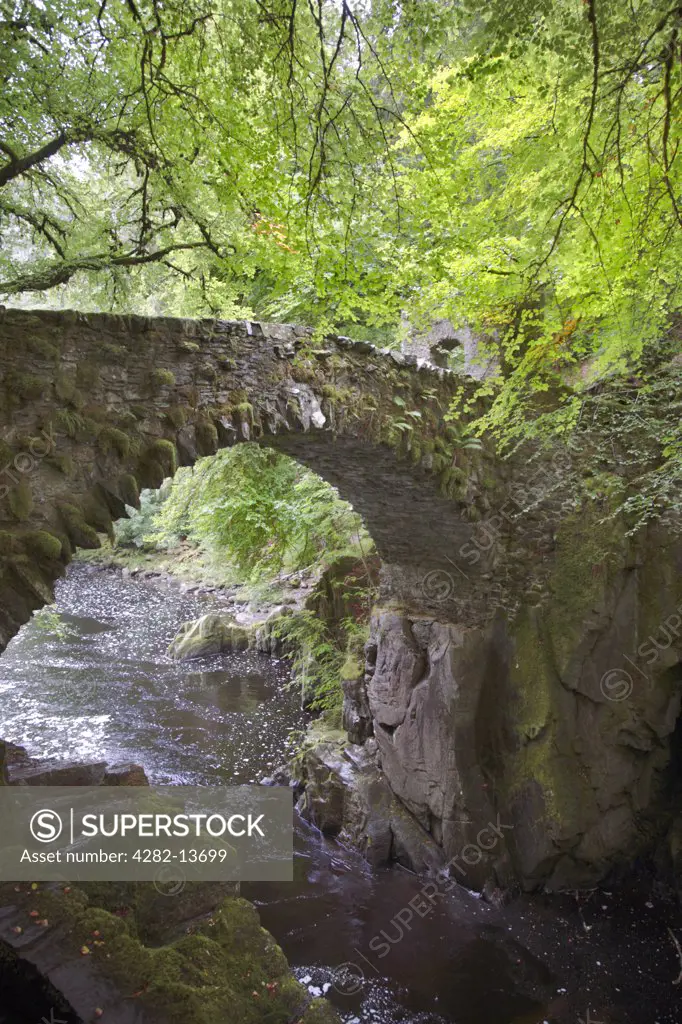 Scotland, Perth and Kinross, Dunkeld. A stone Bridge over the River Braan at the Hermitage near Dunkeld.