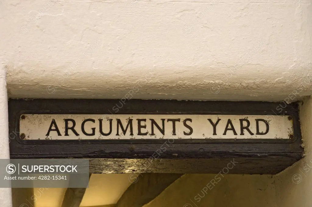 England, North Yorkshire, Whitby. Sign above entrance to Arguments Yard, named after Thomas Argument.