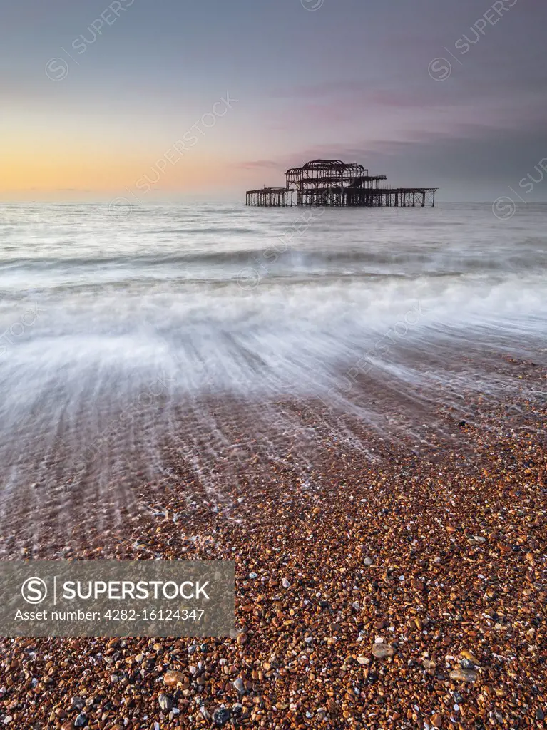 Portrait shot of the old west pier at sunrise.