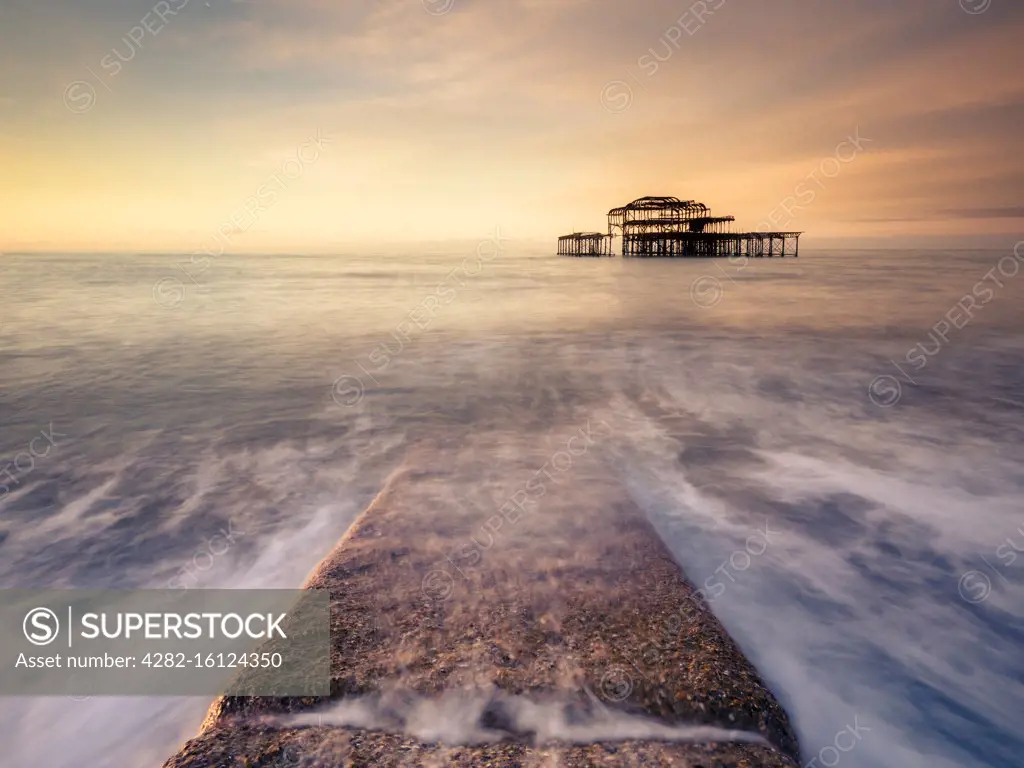 A stone path at sunrise at the old Pier in Brighton.