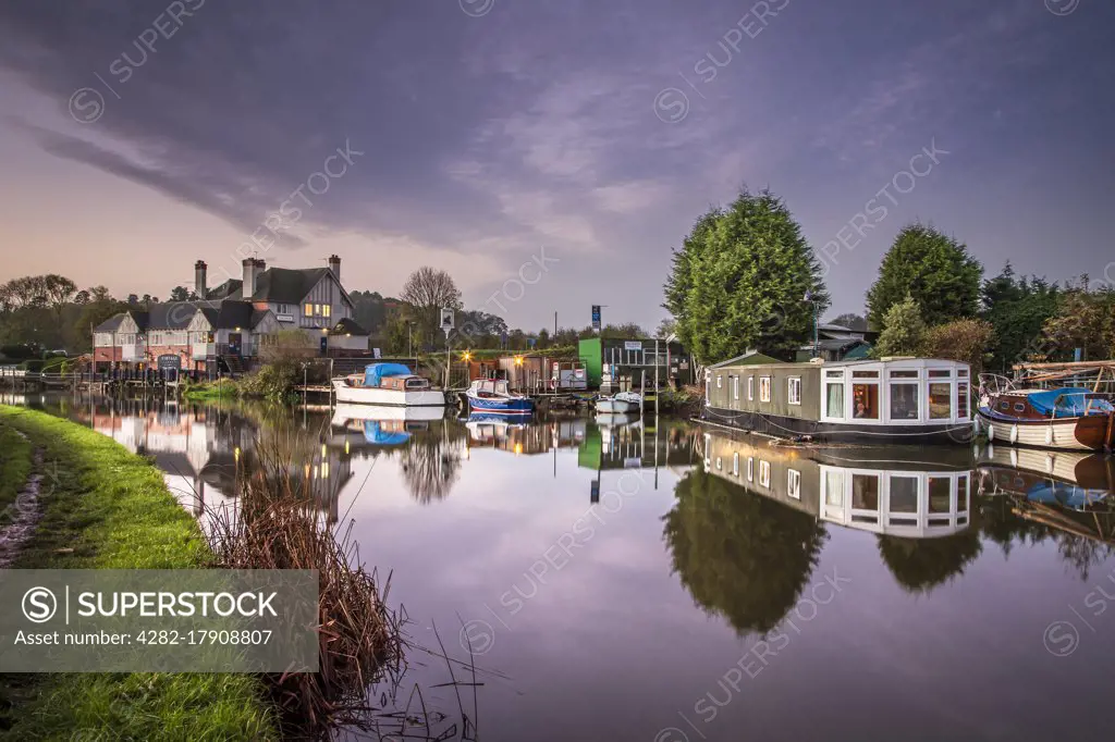 Houseboat on the river Soar with cruisers near The Otter pub and restaurant.