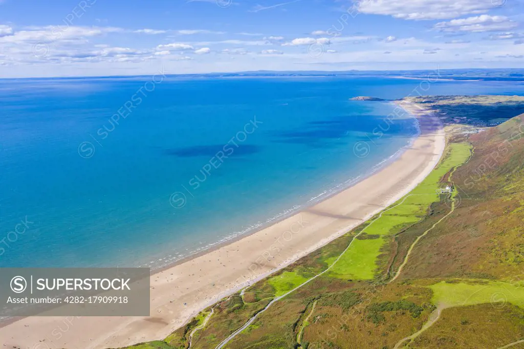 Aerial view of the longest beach in Rhossili Bay in Gower in Wales.