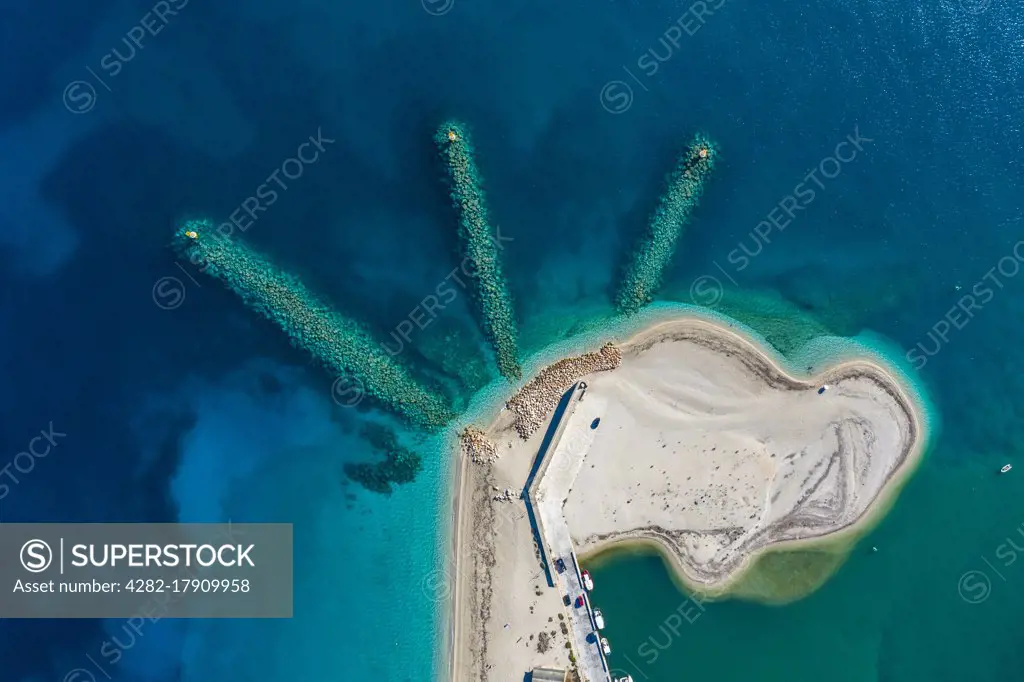 A dinosaur shape beach captured from above in Lefkada in Greece.