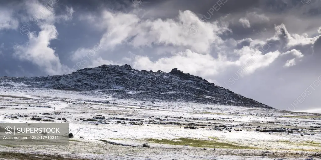 A panoramic image of snow on the wild rugged Rough Tor on Bodmin Moor in Cornwall.