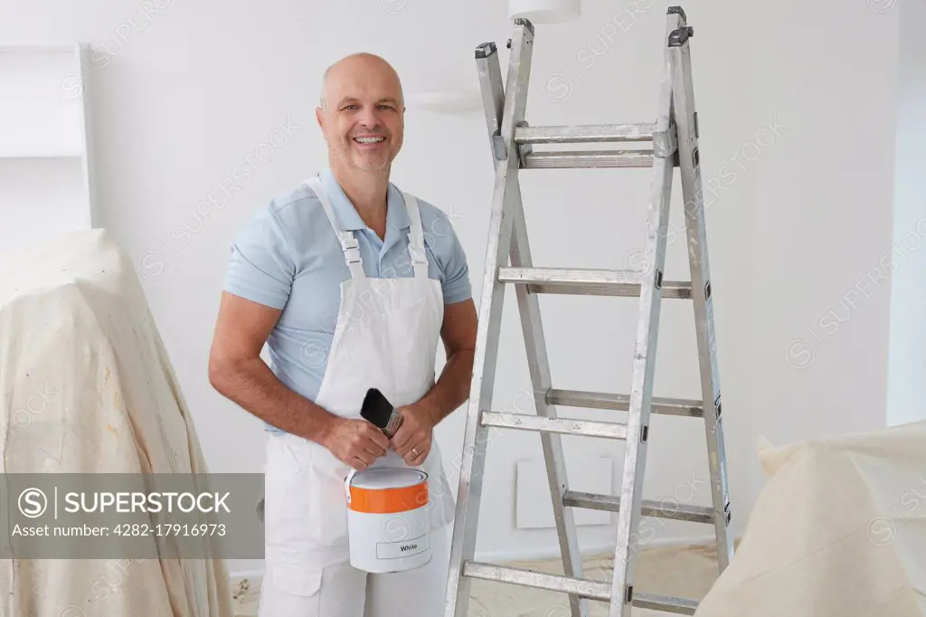 Portrait Of Decorator Painting Room