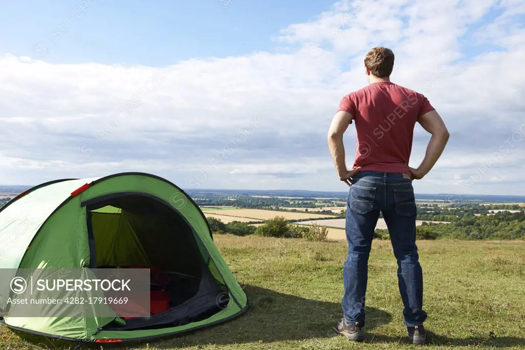 Rear View Of Man Camping And Admiring View