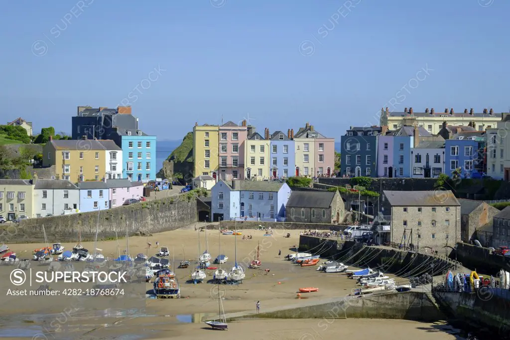 Overview of the colourful harbour at low tide.