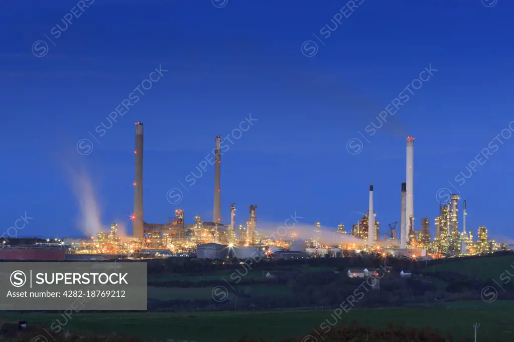 Oil Refinery at Rhoscrowther on Milford Haven Waterway at twilight.