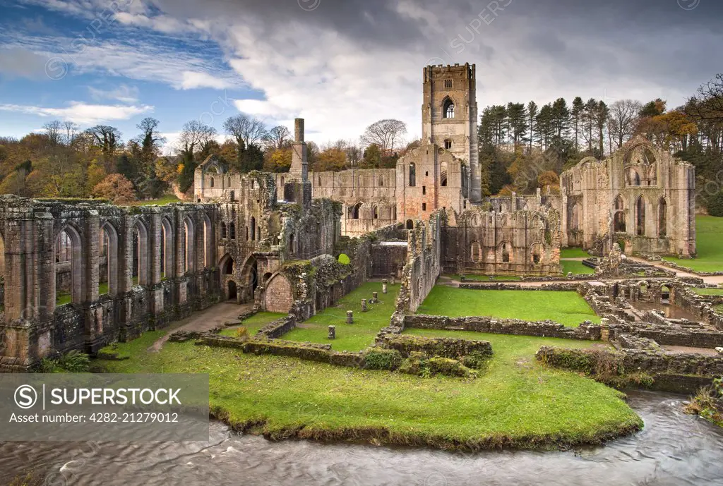 Fountains Abbey and the River Skell in autumn near Ripon.